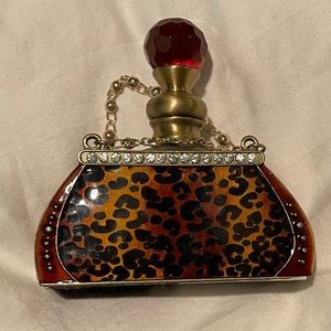 Beautiful rhinestone and leopard perfume bottle.